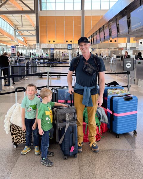 At airport with suitcases and kids
